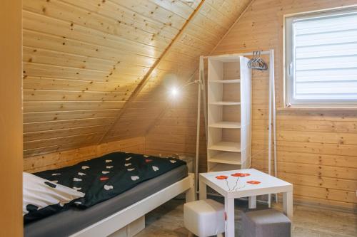 Postel nebo postele na pokoji v ubytování Domek Makowy