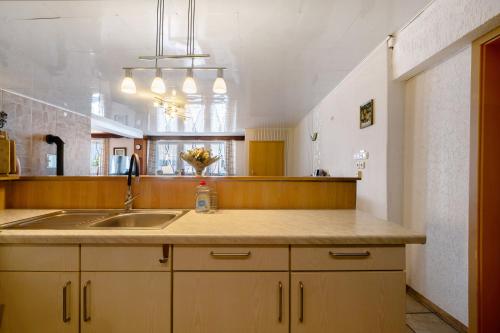 a kitchen with a sink and a counter top at Ferienwohnung Wiesental in Meisburg