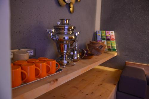 a wooden shelf with orange cups on it at Mountainlodge Luxalpine in San Vigilio Di Marebbe