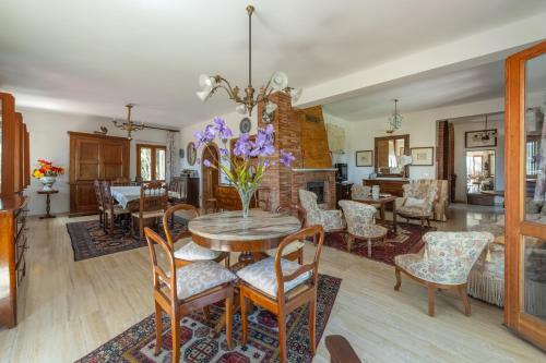 a dining room with a table and chairs at Villa Stipa with pool by Quokka 360 - Close to Riviera delle Palme in Offida
