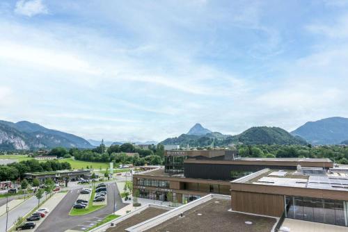 a view of a city with mountains in the background at Best Western Hotel Kiefersfelden in Kiefersfelden
