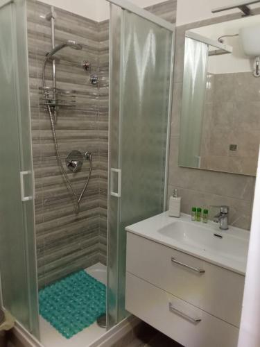 a bathroom with a shower and a sink at Le vie del centro in Sciacca