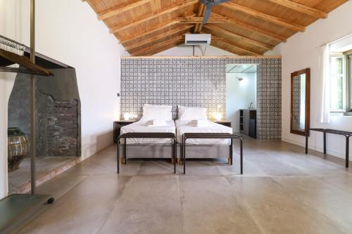 a living room with a table and two chairs at Just Barrett in Rovies