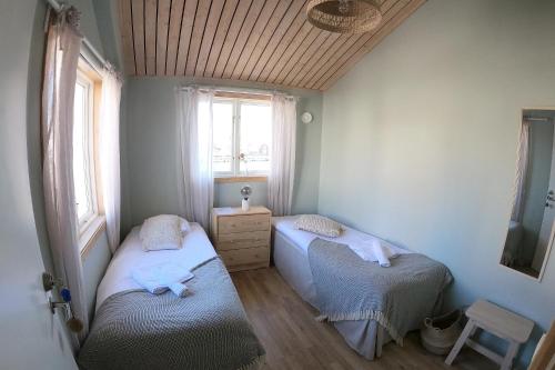 Postel nebo postele na pokoji v ubytování Brygghuset Mollösund
