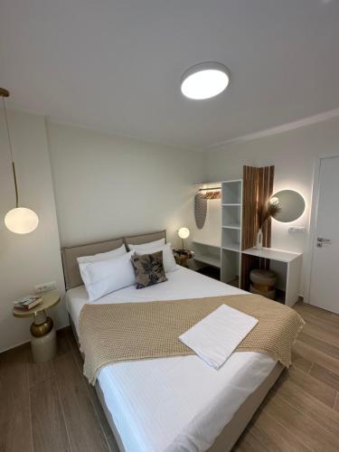 Ένα ή περισσότερα κρεβάτια σε δωμάτιο στο K & L Luxury Suite