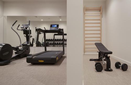 a gym with a treadmill and a exercise bike at Bluesun Hotel Marina in Brela