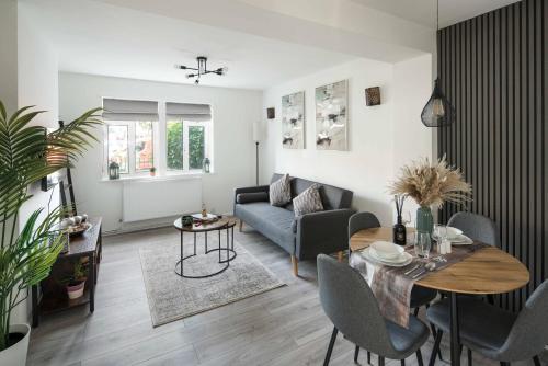 a living room with a couch and a table at 1 Bedroom apartment Kentish town in London