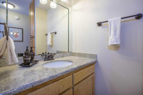 a bathroom with a sink and a mirror at Kihei Akahi Resort - Unit C313 in Wailea