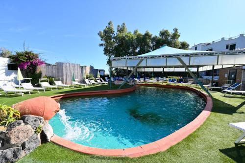 a swimming pool with a gazebo in a yard at Av Isola Verde Hotel Thermal Spa in Ischia