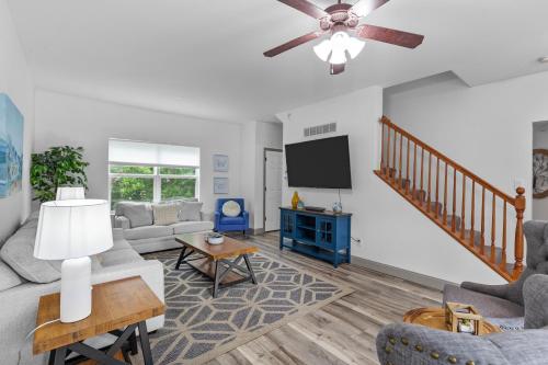 a living room with a couch and a tv at Springhurst Serenity Fresh 4BR Getaway in O'Fallon