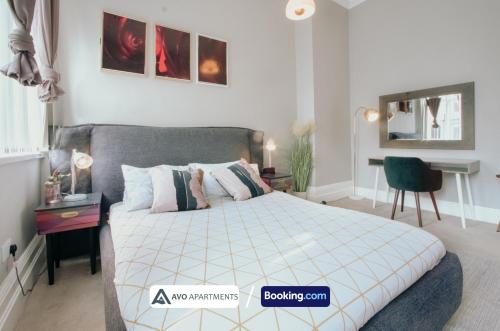 a bedroom with a bed and a desk and a chair at Bessemer House in Sheffield