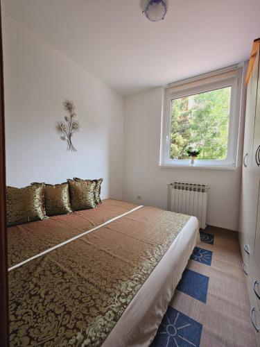 Postel nebo postele na pokoji v ubytování Cozy Sarajevo City Apartment