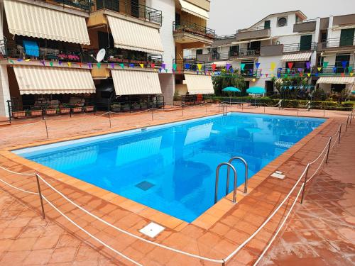 a large swimming pool in front of a building at Sea Garden, fronte mare con piscina in Mascali