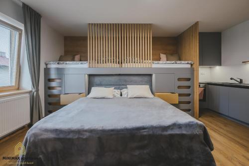Postel nebo postele na pokoji v ubytování MINIMAX apartmán