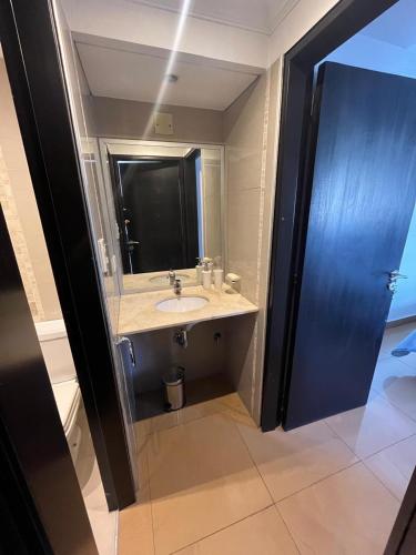 a bathroom with a sink and a mirror at Dpto vista al cerro in Salta