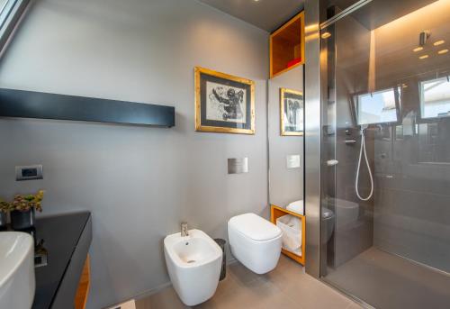 a bathroom with a shower and a toilet and a sink at La Rotonda - Incredible Méditerranéen and St Tropez view 360! Centre ville 5 mns in Saint-Tropez