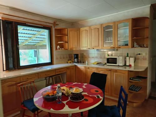 a kitchen with a table with food on it at Le Paradis Blanc Sauna & Spa in Kortetniemi
