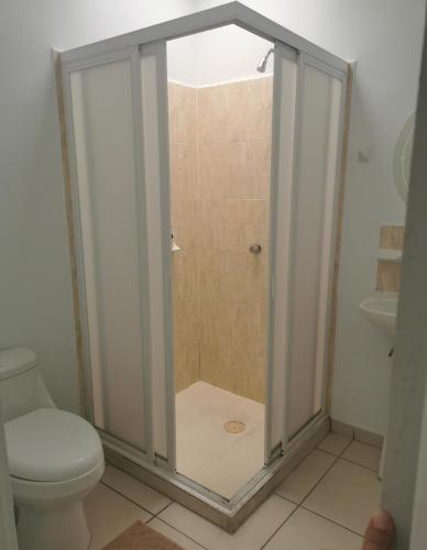 a shower stall in a bathroom with a toilet at Nuevo Vallarta Casa Neptuno in Nuevo Vallarta