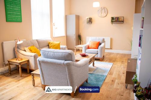 a living room with two chairs and a couch at Bessemer House Sheffield in Sheffield