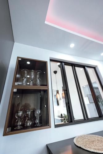 a room with two windows and a table at Prestige Lumineux Jacuzzi Parking privé in Mulhouse