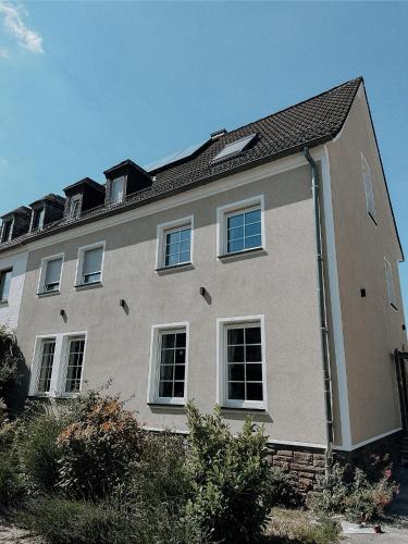 a large house with many windows on top of it at Stilvolles Gästezimmer mit Bad in Mechernich-Zentrum in Mechernich