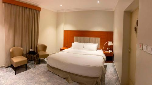 Кровать или кровати в номере Amaken Aparthotel