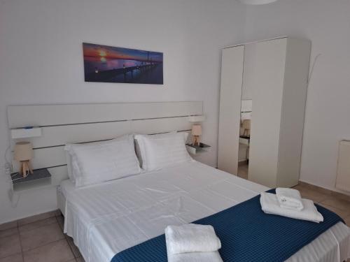Postel nebo postele na pokoji v ubytování Alana apartment