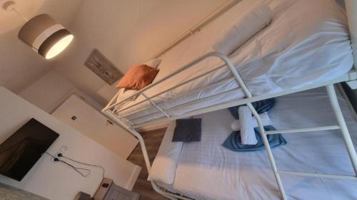 a bunk bed in a room with a tv at 19 Eyre Square Lane Galway in Galway