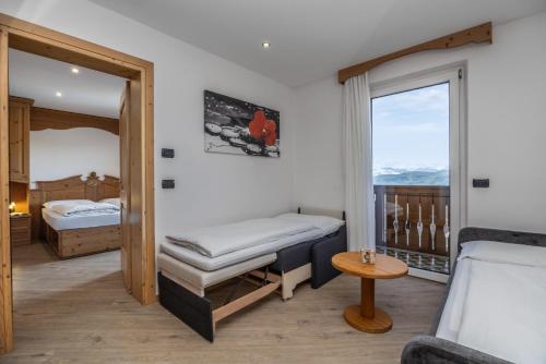 Postel nebo postele na pokoji v ubytování Hotel Tirol- Natural Idyll