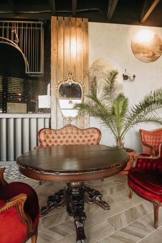 a dining room with a table and two chairs at Moncastro Glamping in Vylkove