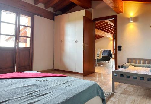 Postel nebo postele na pokoji v ubytování LOFT GARDASEE