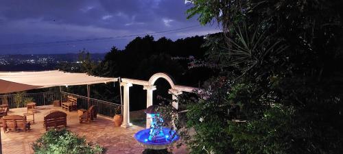 a patio with a tent and a table and chairs at Bellavista Versilia in Pietrasanta
