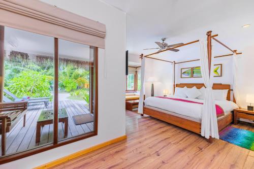 Letto o letti in una camera di Kuramathi Maldives