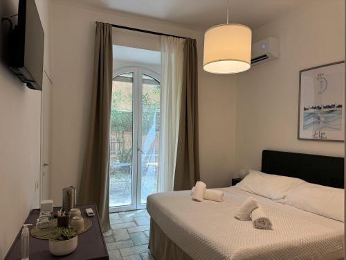 a hotel room with a bed and a window at Gli Arcani in Orvieto