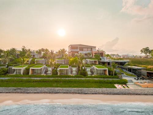 an aerial view of a resort on the beach at MASON, a member of Design Hotels in Na Jomtien
