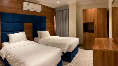 Кровать или кровати в номере Amaken Aparthotel