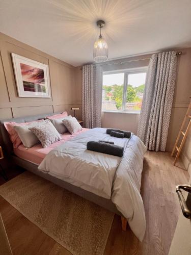 a bedroom with a large bed with a window at Luxury Apartment in Rostrevor in Rostrevor