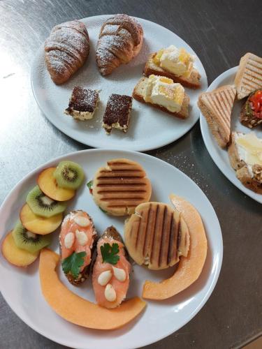 two plates with different types of pastries on them at Bellavista Versilia in Pietrasanta