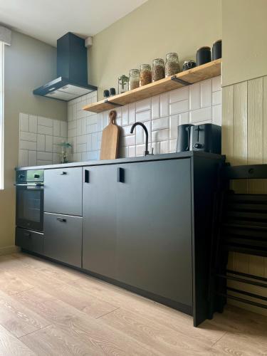 a kitchen with a sink and a stove at Luxury Apartment in Rostrevor in Rostrevor