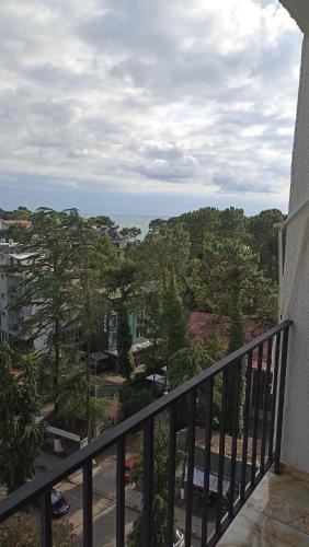 a balcony with a view of a city at ПЕРВАЯ ЛИНИЯ Apartment Zhemchuzhina Ureki-6 STUDI0 in Ureki