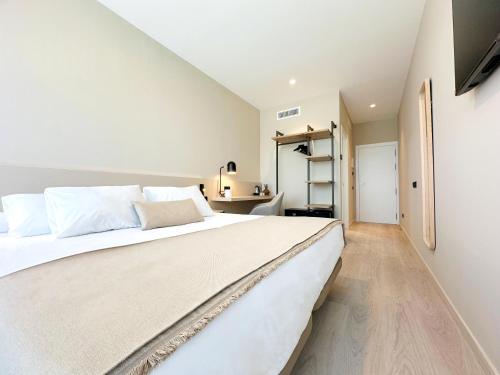 Postel nebo postele na pokoji v ubytování HQ Arena Hotel