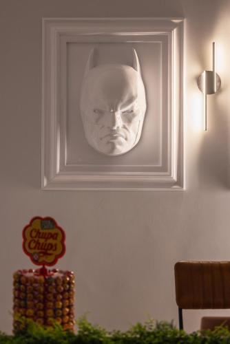 a picture of a mask hanging on a wall at ReMia Suites & Leisure in Alassio