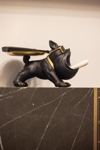 a toy elephant holding a gun on its back at ReMia Suites & Leisure in Alassio