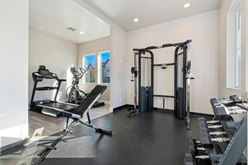 a gym with two tread machines in a room at 30 | Poolhouse at Ocotillo Springs with Private Pool and Views in Santa Clara