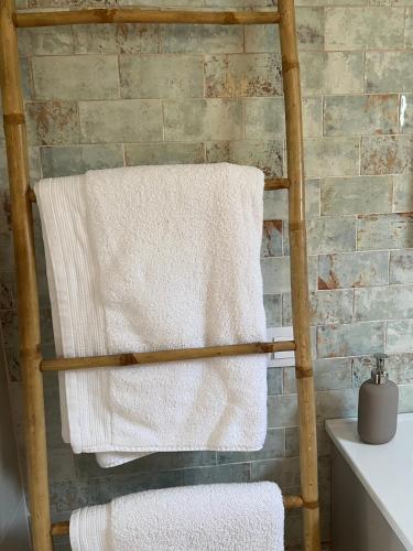 a towel hanging on a towel rack in a bathroom at Casa de Los Lirios in Muro de Alcoy