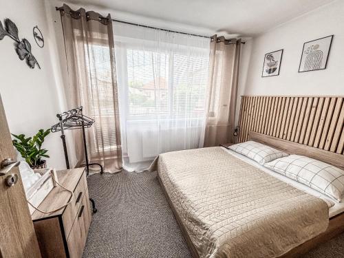 Postel nebo postele na pokoji v ubytování ViVi Apartments