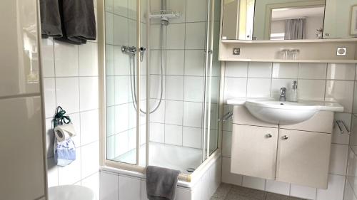 a bathroom with a shower and a sink at Das Ruebezahl in Reit im Winkl