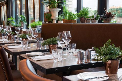a table set up for a restaurant with wine glasses at The Milner York in York