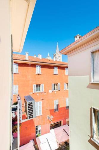 a view of a building from a balcony at Domus: modern Loft in the center of Parma in Parma