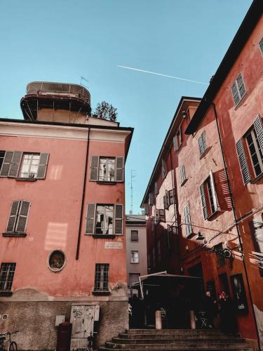 a building with a water tank on top of it at Domus: modern Loft in the center of Parma in Parma